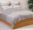 Omkeerbare deken als smaakvolle sprei voor uw interieur Omkeerbare sprei over een bed in de kleur grijs in de afmeting 220x250 cm