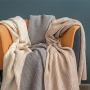 Gebreide deken van mulesingvrije scheerwol in 3 kleuren